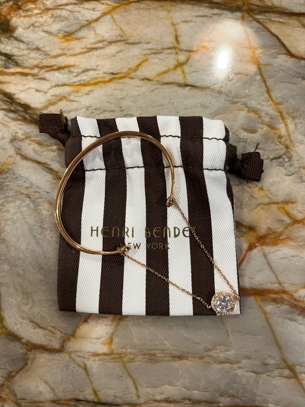 henri bendel gold-tone bracelet and pendant necklace with clear crystal